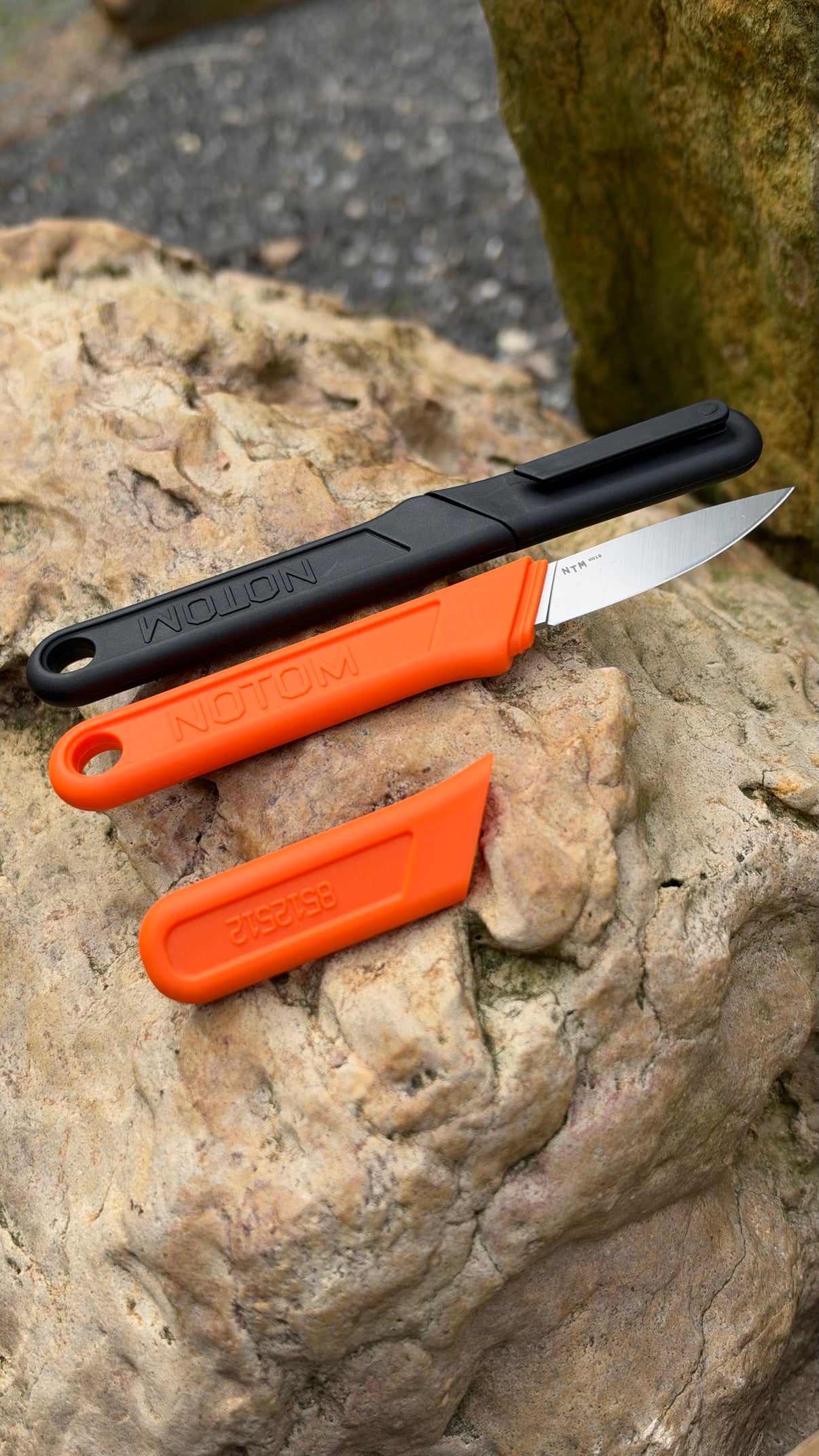 NOTOM NP40 fixed blade paring knife with sheath on a rock