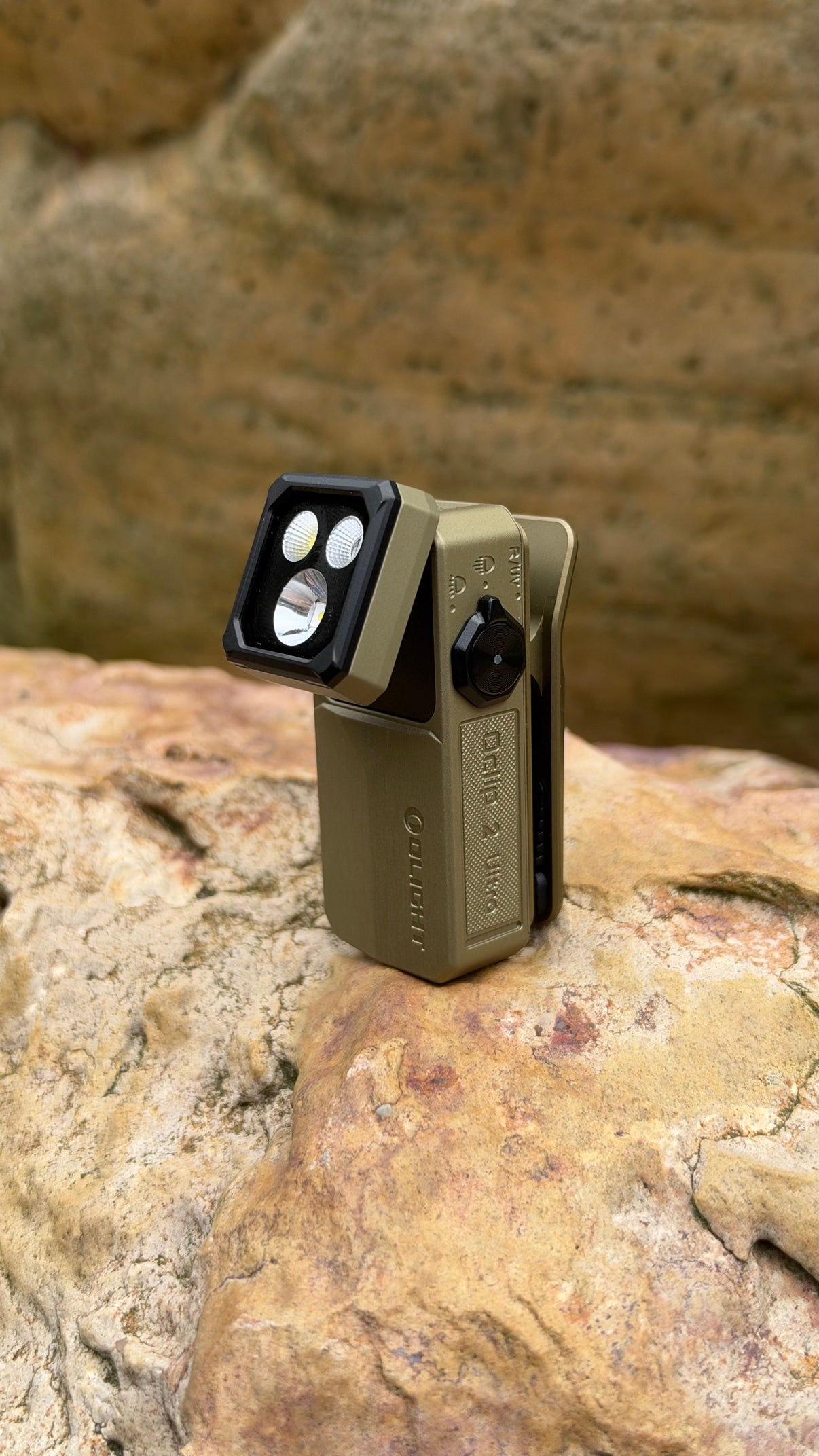 OLIGHT Oclip 2 Ultra clip light standing on a rock